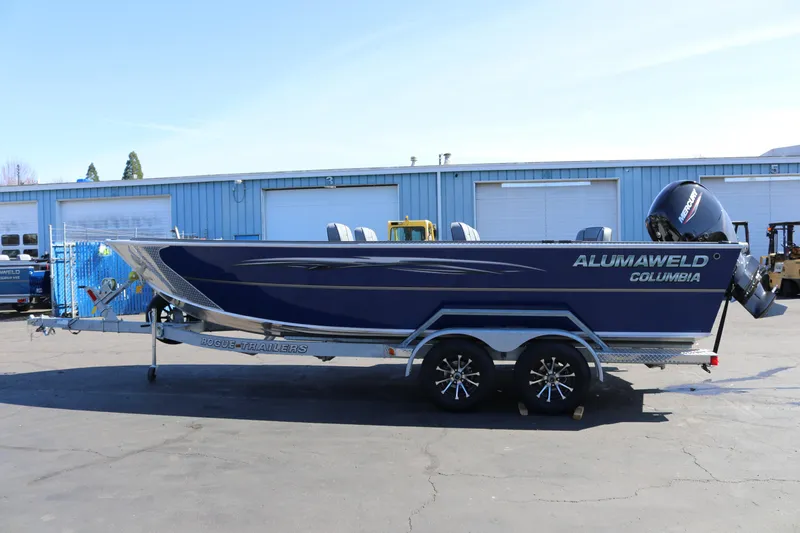 Slide: The Image of 2026 Alumaweld Columbia 21 boat on trailer, parked outside industrial building. - 5