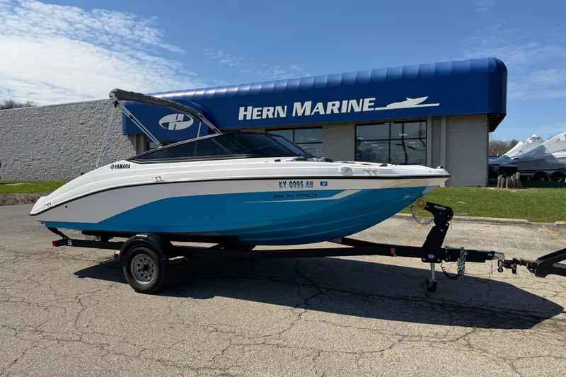 The Image of 2023 Yamaha Boats SX190 on trailer outside Hern Marine dealership. - 0