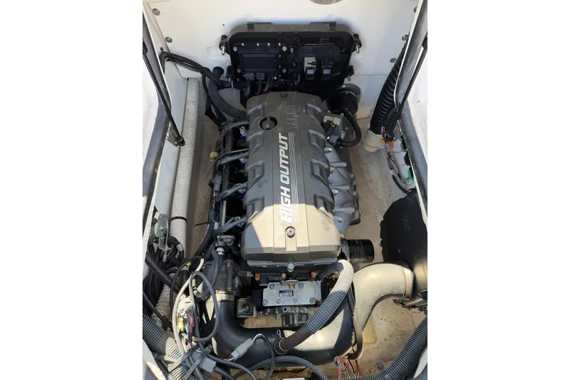 Slide: The Image of 2023 Yamaha Boats SX190 engine compartment showcasing high output engine. - 11
