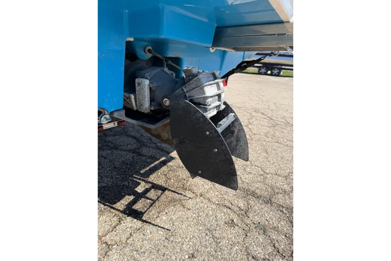 Slide: The Image of 2023 Yamaha Boats SX190 jet drive system close-up on pavement. - 13