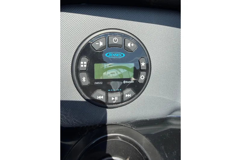 Slide: The Image of 2023 Yamaha Boats SX190 audio control panel with Bluetooth connectivity. - 14