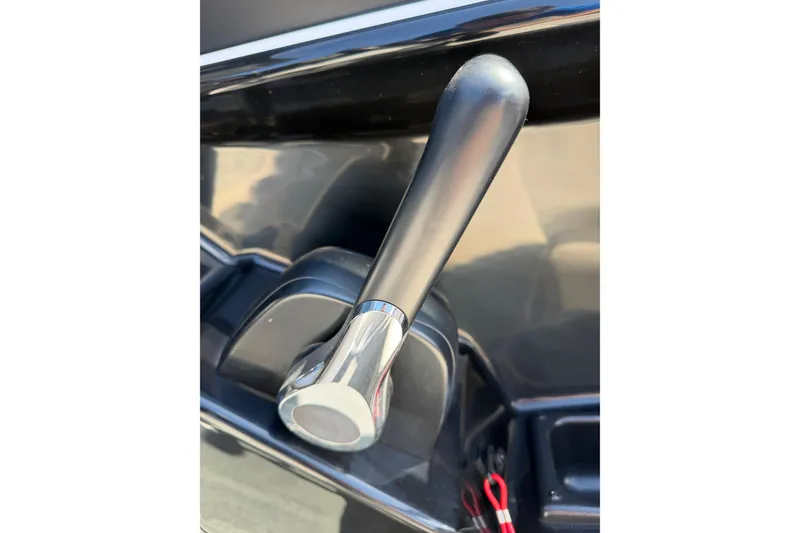 Slide: The Image of Close-up of 2023 Yamaha SX190 boat throttle lever, showcasing sleek design and functionality. - 15