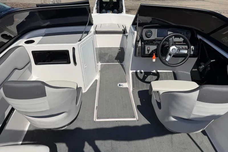 Slide: The Image of 2023 Yamaha Boats SX190 interior with steering wheel, seating, and dashboard controls. - 3