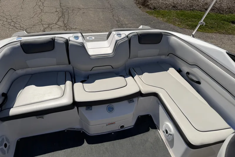 Slide: The Image of 2023 Yamaha Boats SX190 interior seating with cushioned layout and cup holders. - 4