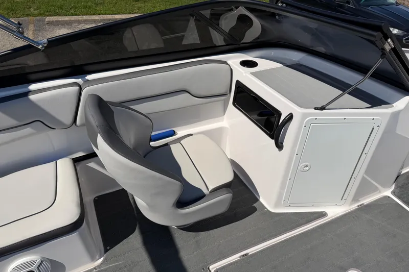 Slide: The Image of 2023 Yamaha Boats SX190 interior with gray seating and modern dashboard design. - 8