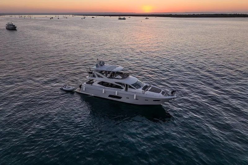 Slide: The Image of Sunseeker Manhattan 73 yacht on calm waters at sunset, 2012 model. - 14