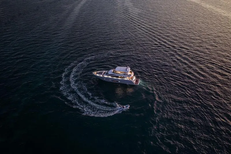 Slide: The Image of Aerial view of 2012 Sunseeker Manhattan 73 yacht cruising on open water. - 15
