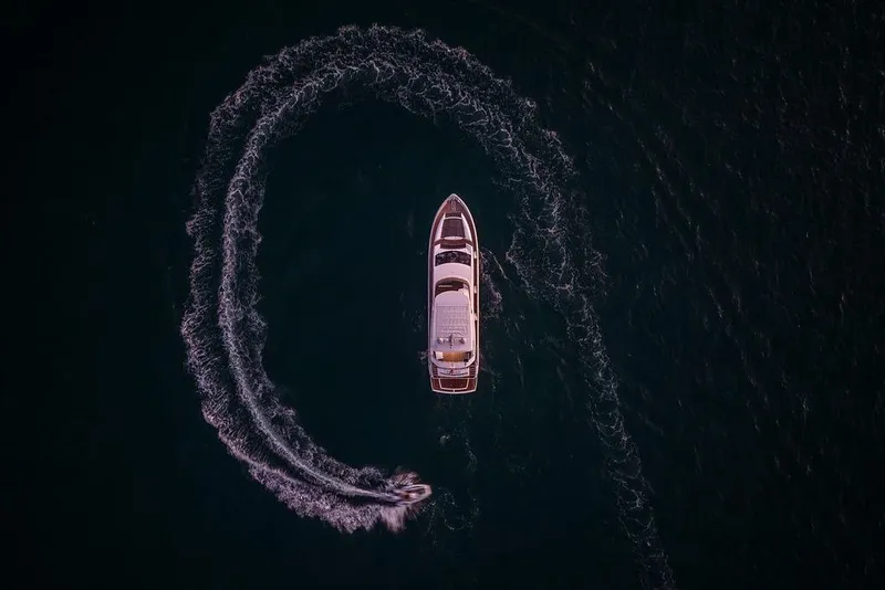 Slide: The Image of Aerial view of 2012 Sunseeker Manhattan 73 yacht with jet ski circling. - 17