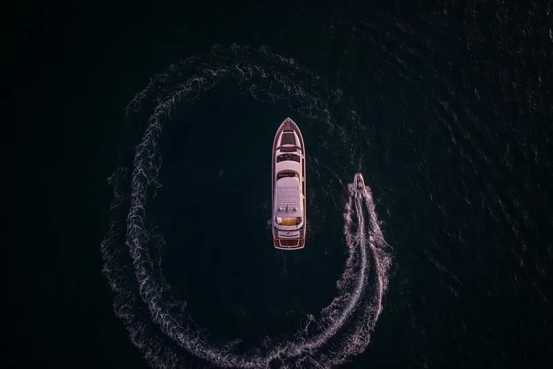 Slide: The Image of Aerial view of 2012 Sunseeker Manhattan 73 yacht making a circular wake pattern. - 18