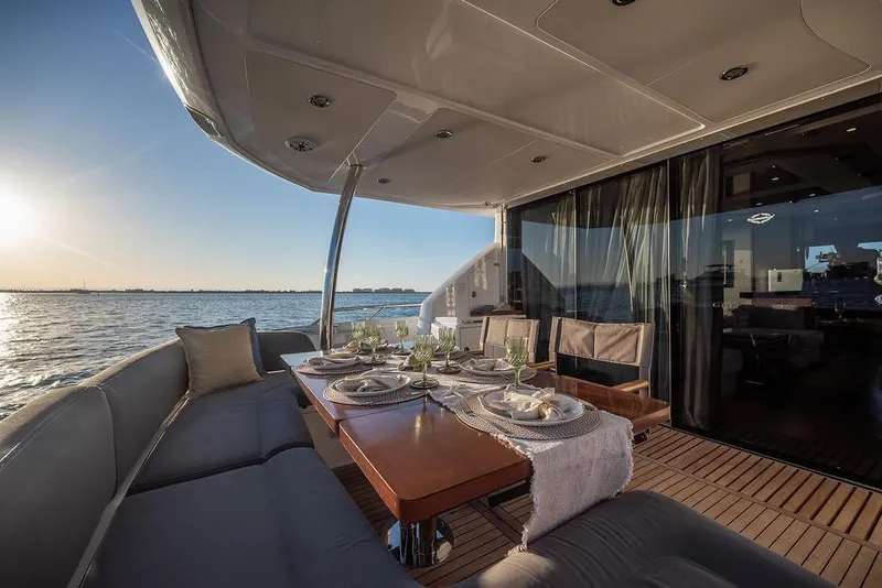 Slide: The Image of Luxurious Sunseeker Manhattan 73 yacht deck with elegant dining setup, 2012 model. - 23