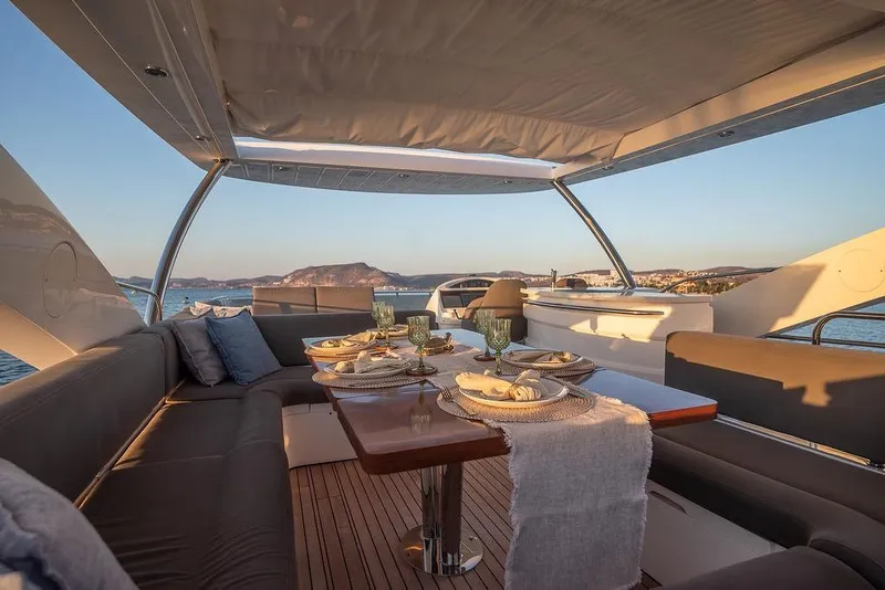 Slide: The Image of Luxurious dining area on 2012 Sunseeker Manhattan 73 yacht with ocean view. - 29