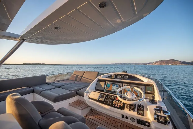 Slide: The Image of Luxurious 2012 Sunseeker Manhattan 73 yacht interior with ocean view and modern helm. - 30