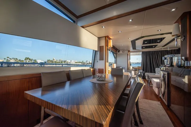 Slide: The Image of Luxurious interior of 2012 Sunseeker Manhattan 73 yacht with elegant dining area and panoramic windows. - 41
