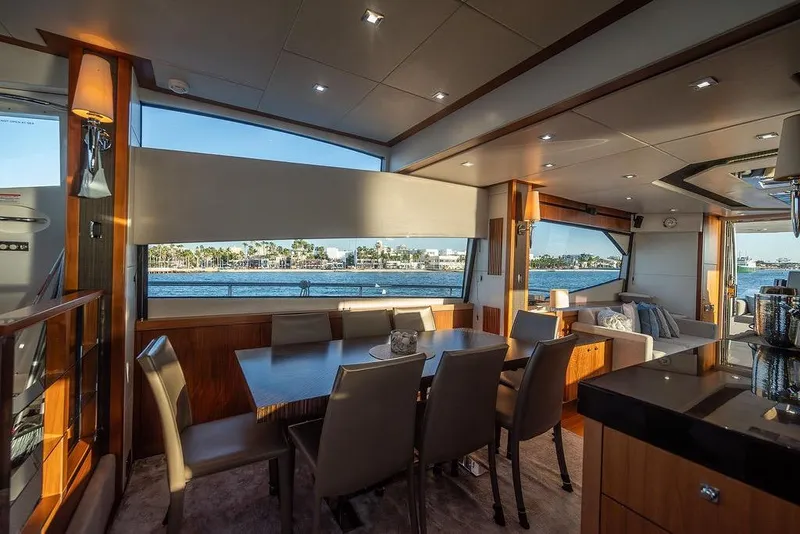 Slide: The Image of Luxurious interior of 2012 Sunseeker Manhattan 73 yacht with elegant dining area and waterfront view. - 42