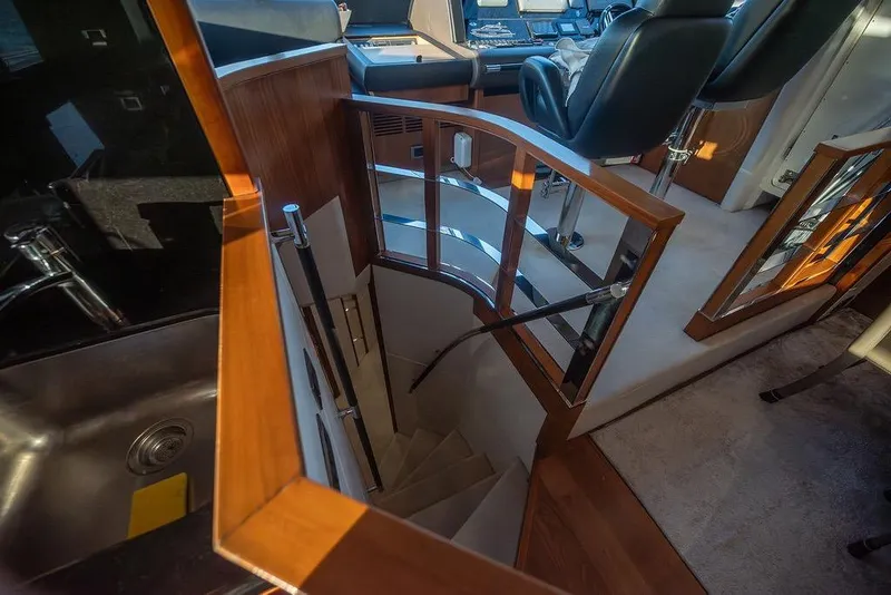 Slide: The Image of Interior of 2012 Sunseeker Manhattan 73 yacht, featuring stairs and helm area. - 47