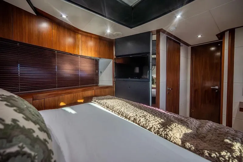 Slide: The Image of Luxurious cabin interior of 2012 Sunseeker Manhattan 73 yacht with wood paneling and modern amenities. - 51