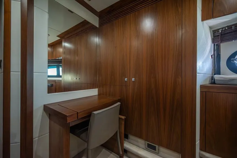 Slide: The Image of Luxurious wooden interior of 2012 Sunseeker Manhattan 73 yacht with desk and chair. - 53