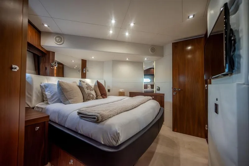 Slide: The Image of Luxurious bedroom interior of 2012 Sunseeker Manhattan 73 yacht with elegant wood finishes. - 56