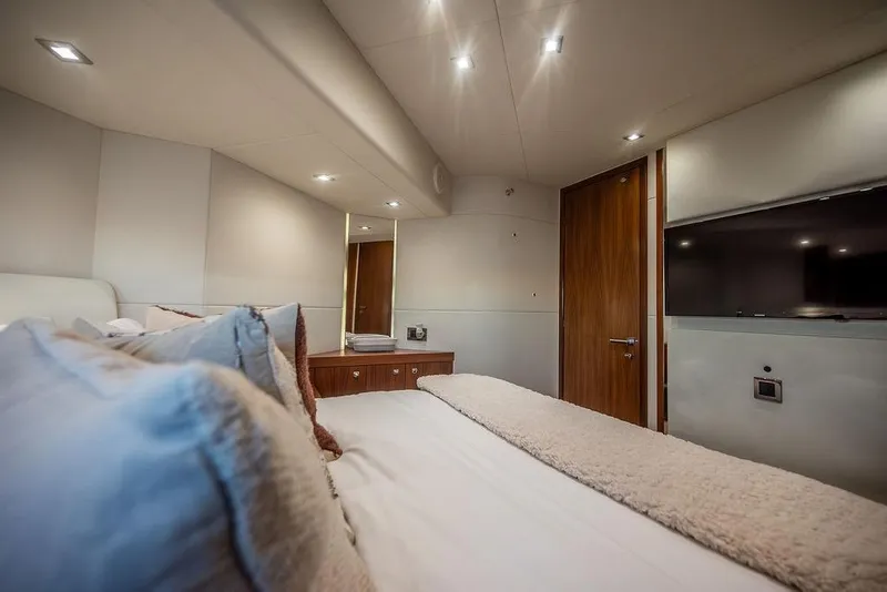 Slide: The Image of Luxurious bedroom interior of 2012 Sunseeker Manhattan 73 yacht with modern decor and lighting. - 58