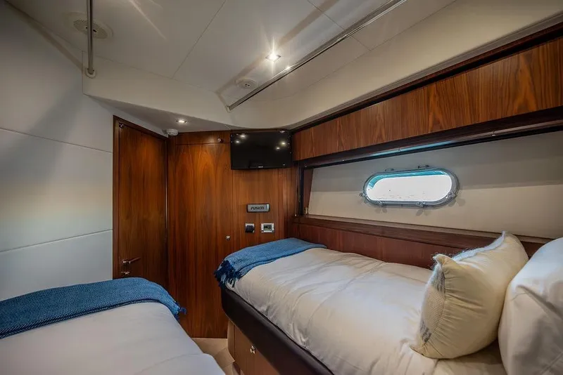 Slide: The Image of Luxurious cabin interior of 2012 Sunseeker Manhattan 73 yacht with twin beds. - 60