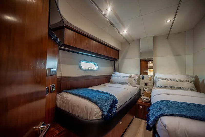 Slide: The Image of Luxurious twin cabin interior of 2012 Sunseeker Manhattan 73 yacht with elegant wood finishes. - 63