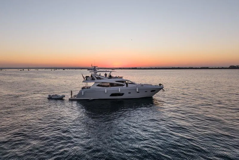 Slide: The Image of Sunseeker Manhattan 73 yacht at sunset on calm waters, 2012 model. - 7