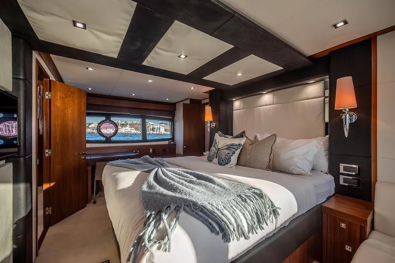 Slide: The Image of Luxurious bedroom interior of 2012 Sunseeker Manhattan 73 yacht with elegant decor. - 73