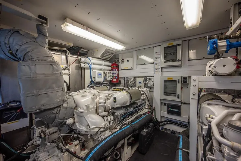 Slide: The Image of Engine room of a 2012 Sunseeker Manhattan 73 yacht, showcasing machinery and equipment. - 81