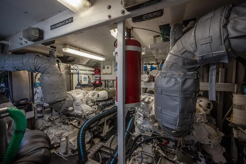 Slide: The Image of Engine room of a 2012 Sunseeker Manhattan 73 yacht, showcasing machinery and equipment. - 82