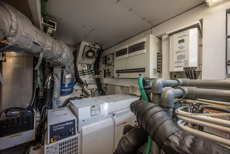 Slide: The Image of Engine room of 2012 Sunseeker Manhattan 73 yacht with Cummins Onan generator. - 83