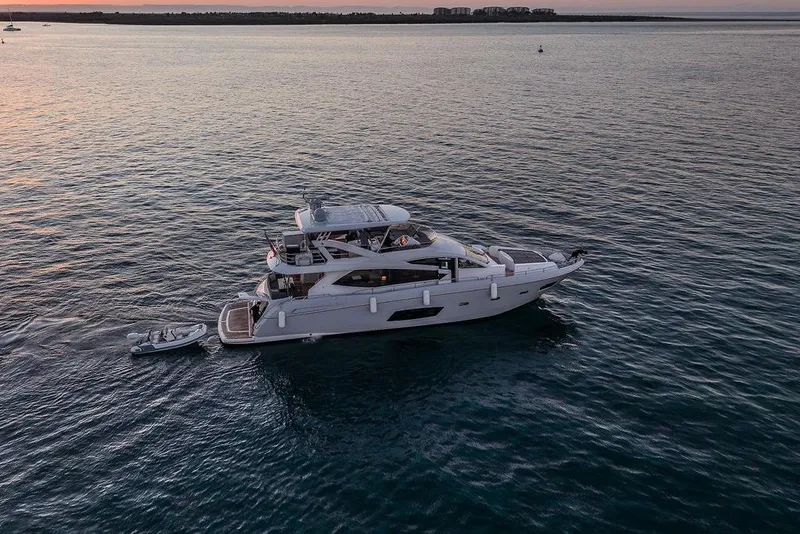 Slide: The Image of Luxury Sunseeker Manhattan 73 yacht cruising at sunset, 2012 model. - 9