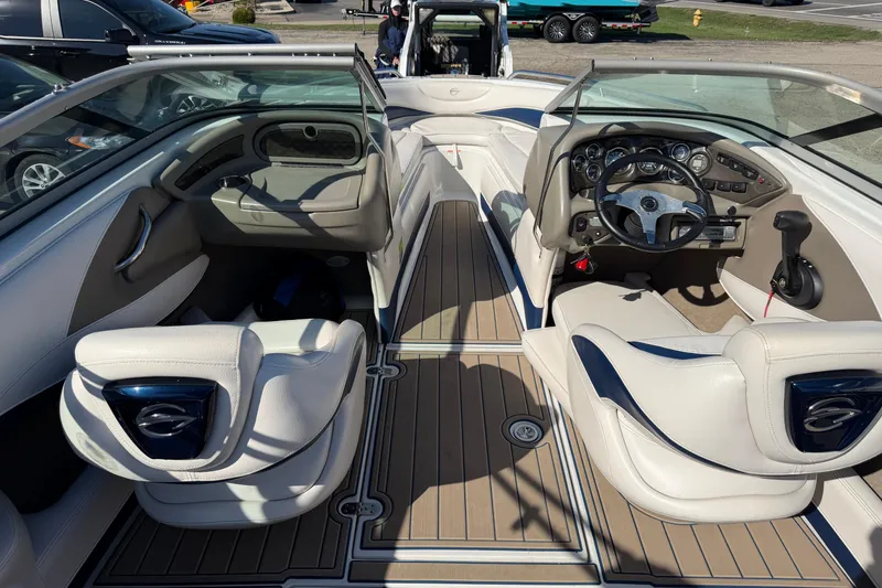 Slide: The Image of Interior of a 2011 Crownline 21 SS boat with sleek dashboard and seating. - 10