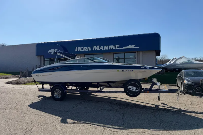 Slide: The Image of 2011 Crownline 21 SS boat on trailer outside Hern Marine dealership. - 15