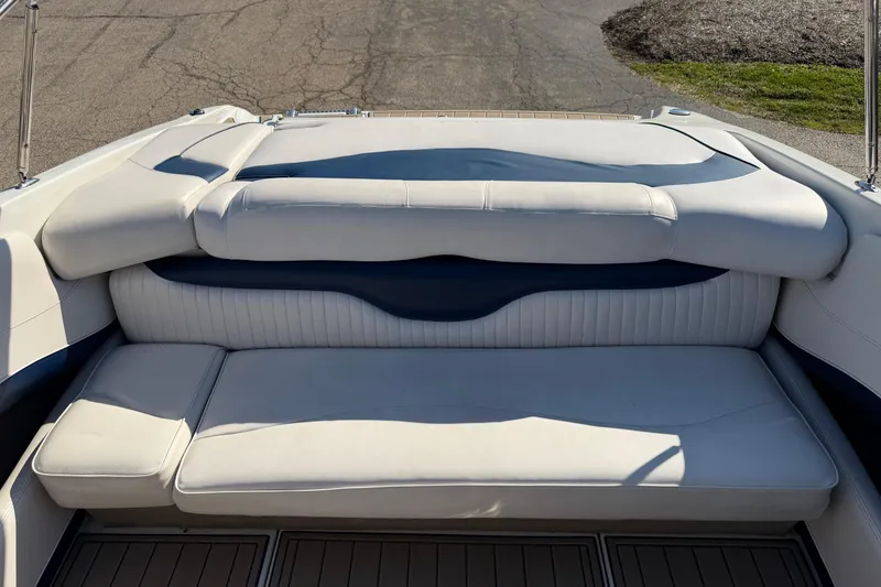 Slide: The Image of 2011 Crownline 21 SS boat interior with white cushioned seating. - 4