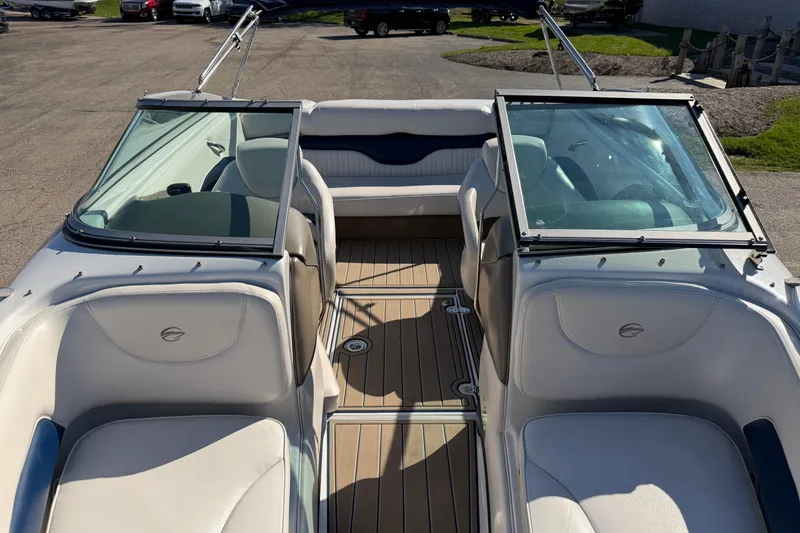 Slide: The Image of Interior view of a 2011 Crownline 21 SS boat with open seating and windshield. - 5