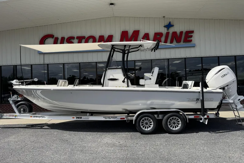 The Image of 2026 Pathfinder 2600 TRS boat on trailer at Custom Marine dealership. - 0