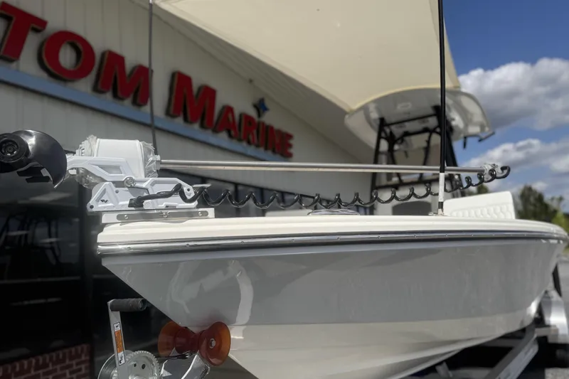 Slide: The Image of 2026 Pathfinder 2600 TRS boat displayed at a marine dealership. - 10
