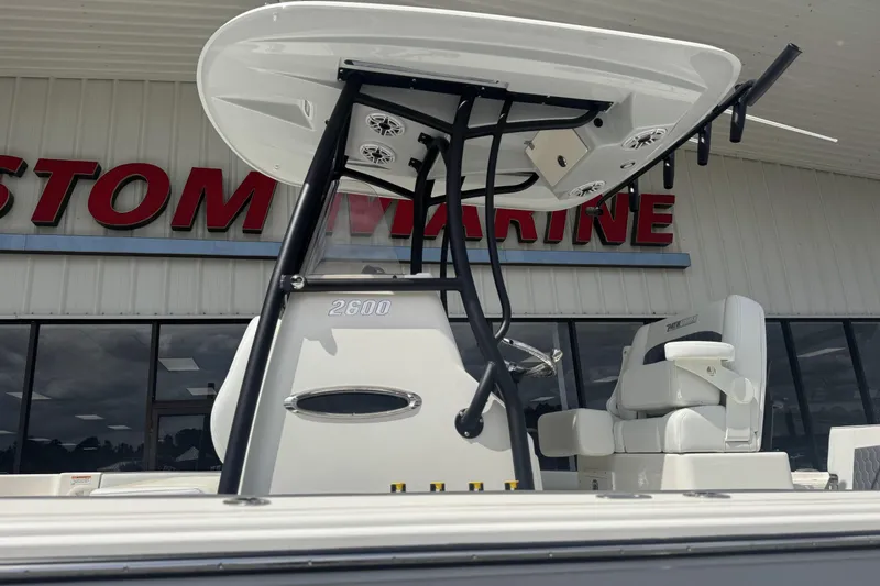 Slide: The Image of 2026 Pathfinder 2600 TRS boat displayed at a marine dealership. - 12