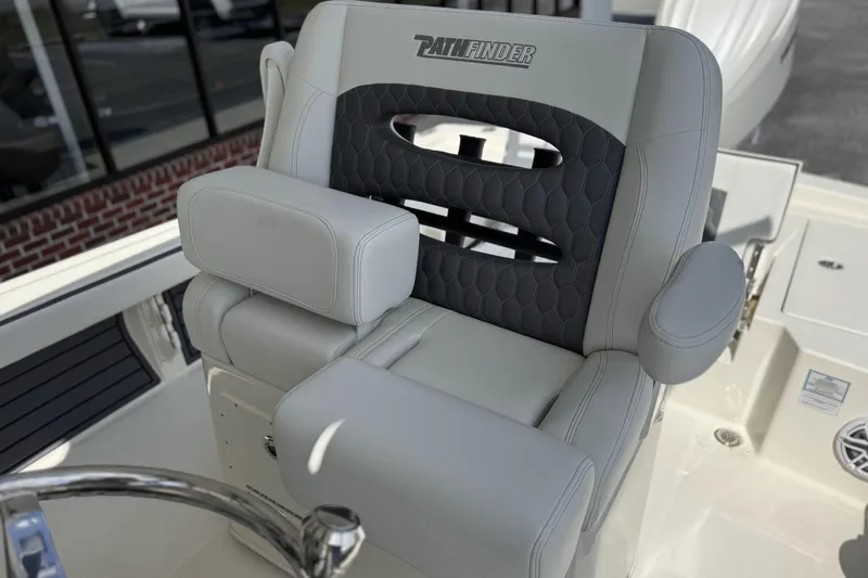 Slide: The Image of 2026 Pathfinder 2600 TRS boat seat with gray upholstery and armrests. - 16