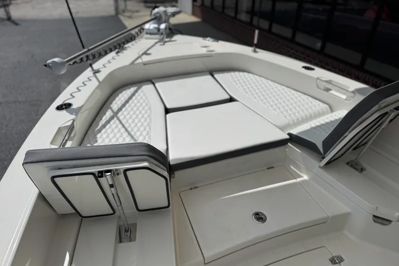 Slide: The Image of 2026 Pathfinder 2600 TRS boat interior with cushioned seating and storage compartments. - 18