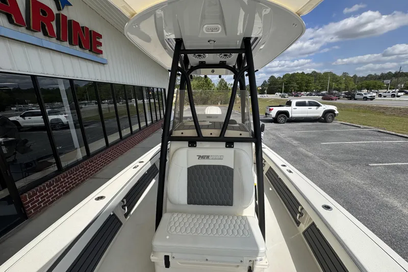 Slide: The Image of 2026 Pathfinder 2600 TRS boat at dealership, showcasing seating and console design. - 20
