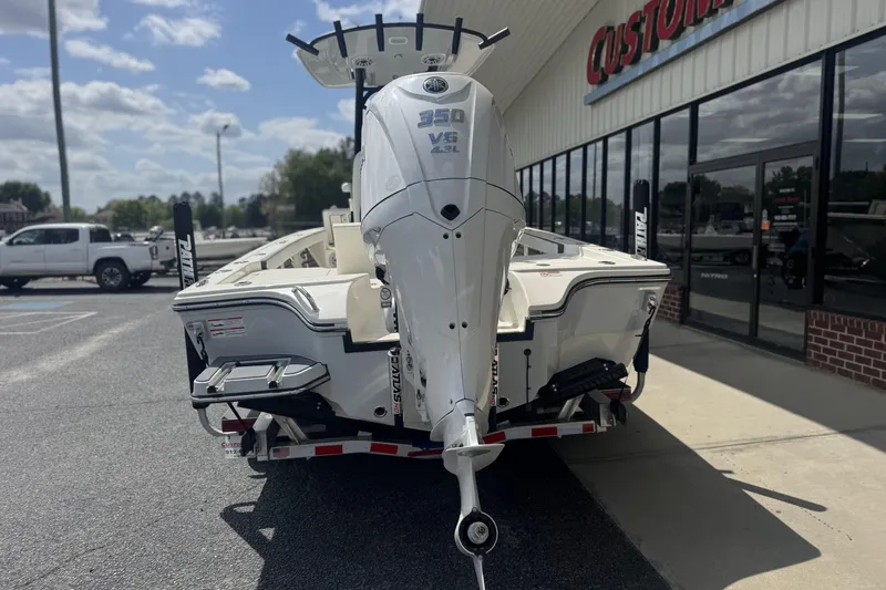 Slide: The Image of 2026 Pathfinder 2600 TRS boat with powerful 350 V8 engine, parked outside dealership. - 27