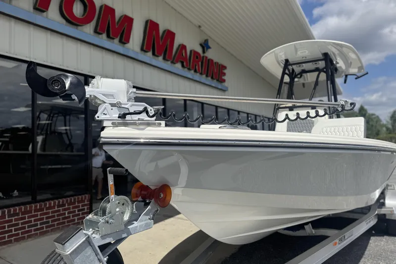 Slide: The Image of 2026 Pathfinder 2600 TRS boat on trailer outside marine dealership. - 29