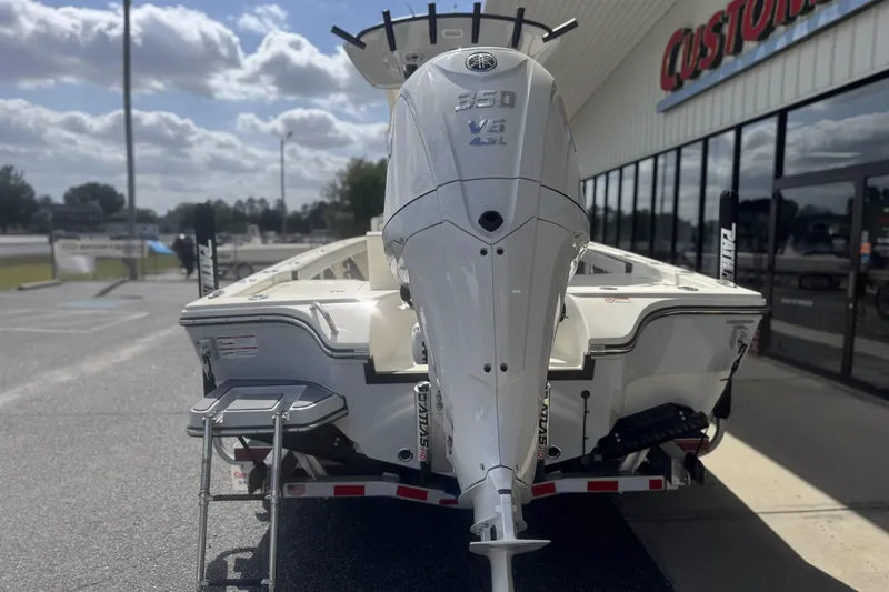 Slide: The Image of 2026 Pathfinder 2600 TRS boat with Yamaha 350 V8 engine, parked outside a dealership. - 6