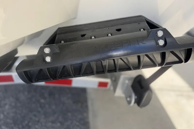 Slide: The Image of Close-up of a 2026 Pathfinder 2600 TRS boat component with visible bolts. - 7