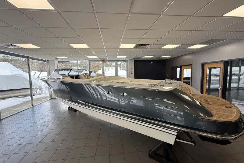 The Image of 2024 Comitti Venezia V28 luxury boat displayed in a showroom. - 1