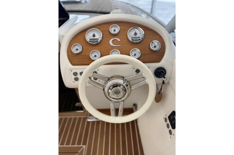 Slide: The Image of 2024 Comitti Venezia V28 dashboard with classic wooden accents and modern gauges. - 10
