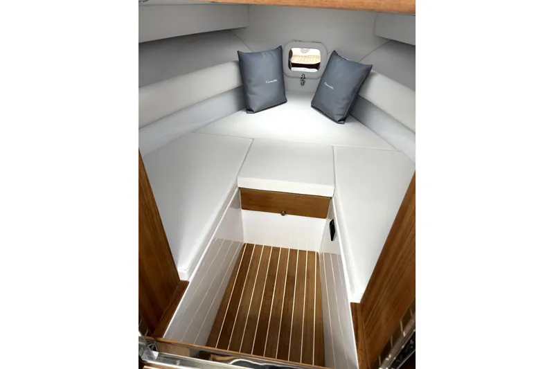 Slide: The Image of Luxurious interior of 2024 Comitti Venezia V28 boat with elegant wood and white upholstery. - 13