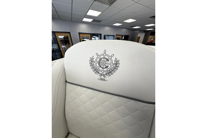 Slide: The Image of Luxurious interior of 2024 Comitti Venezia V28 with embroidered emblem on white leather seat. - 14