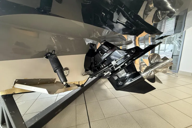 Slide: The Image of 2024 Comitti Venezia V28 boat underside with propeller and drive system in showroom. - 3